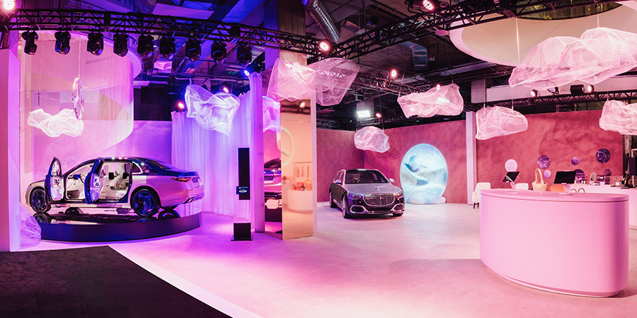 Dim hallway with LED lights leading to Mercedes-Benz showcase room